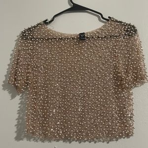 See through, hand made bead shirt.